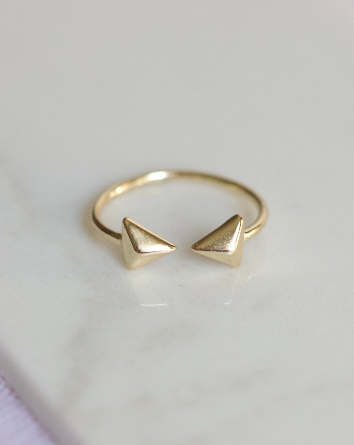 Gold plated open band ring with pyramids